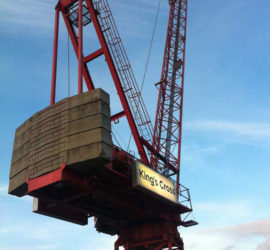 A red crane with a Kings Cross sign