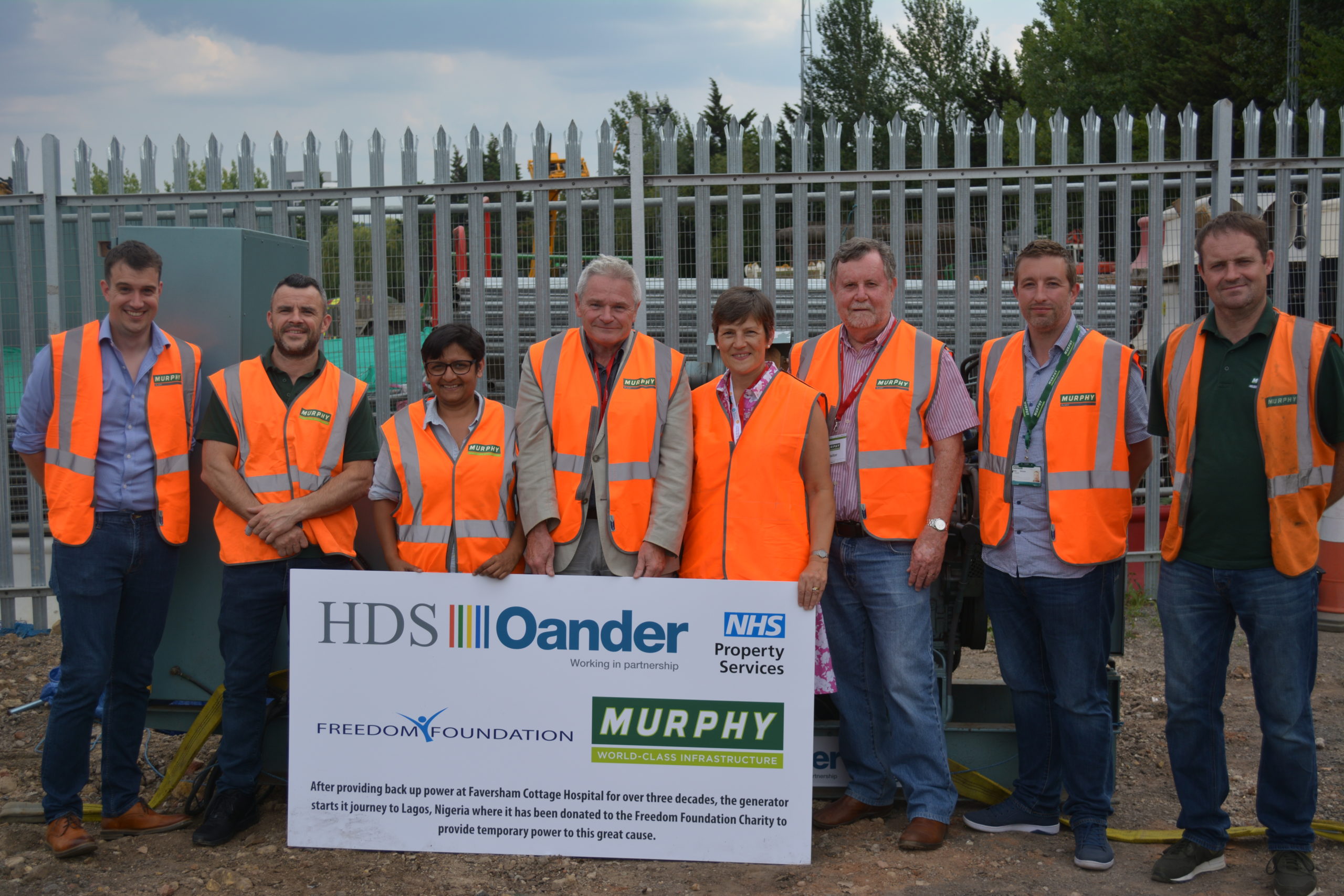 Staff from J Murphy and Oander in front of the former backup generator