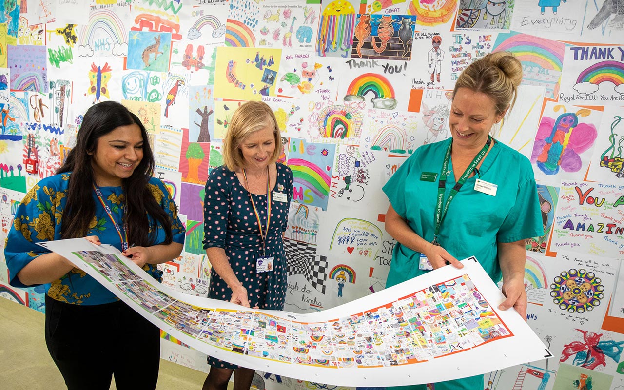 nurses enjoy artwork for Oander and the Roayl Free Charity re decoration of ICU ward