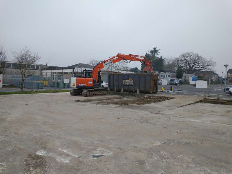 digger clears up after demolition works at st Marks hospital