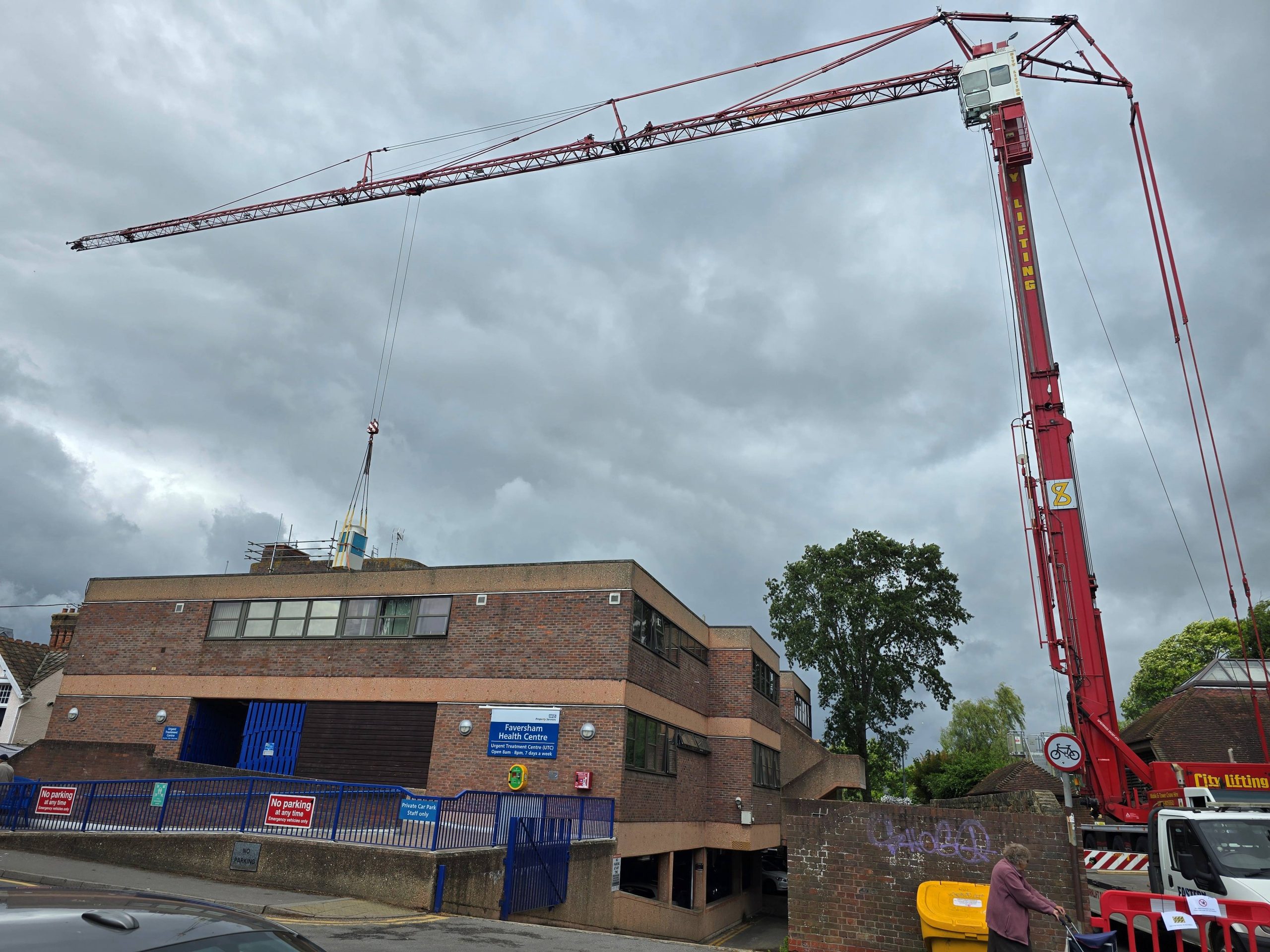 50t crane lifts ac unit off roof at Faversham Cottage Hospital during HVAC upgrade